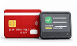 Bank card and payment terminal showing an approved transaction