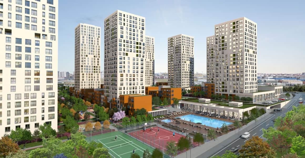 Aerial view of a modern residential complex with a pool and sports courts in Istanbul